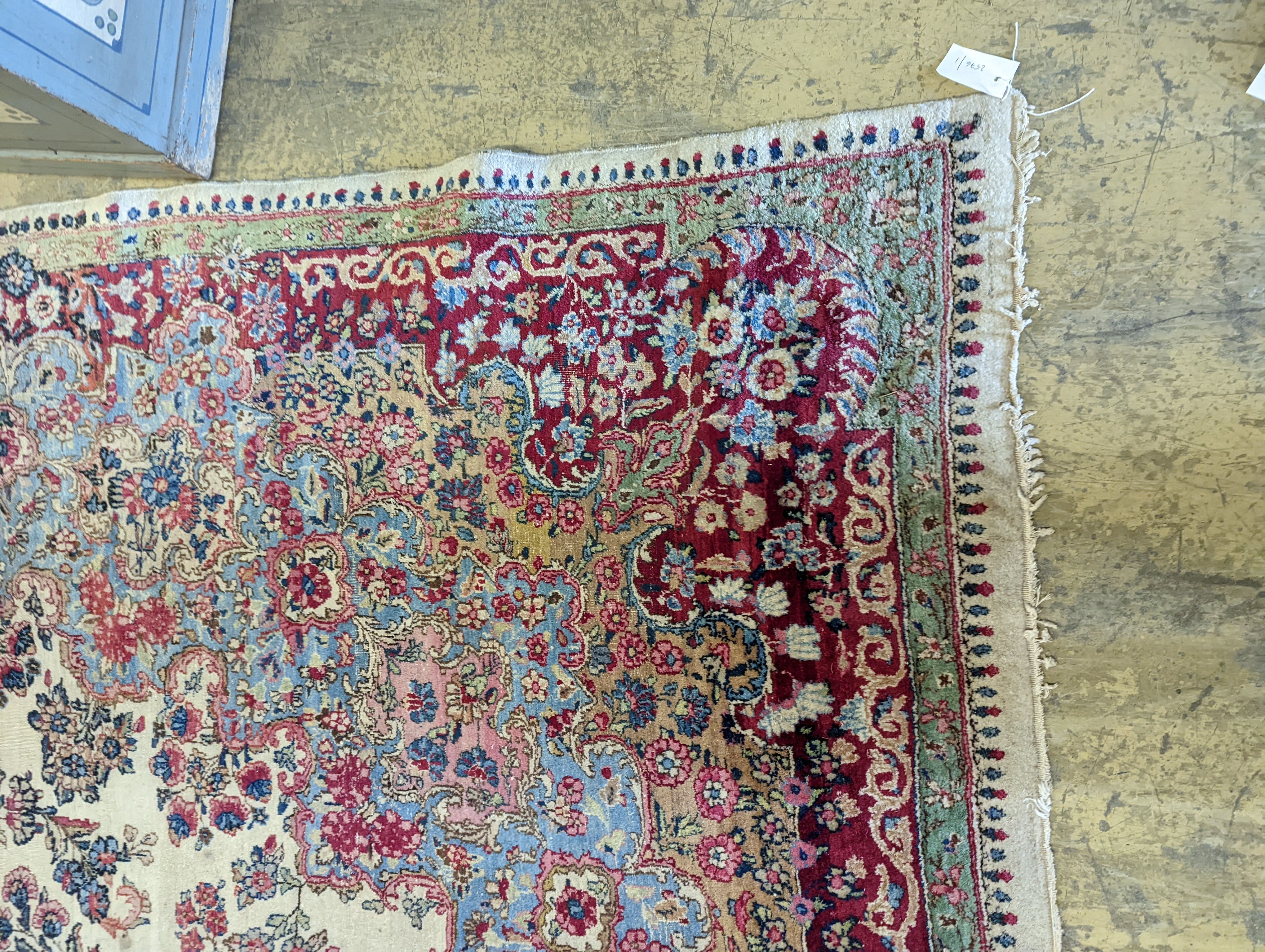 A North West Persian ivory ground carpet, 396 x 290cm